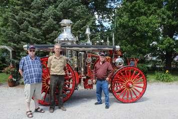 Stan Uher of Blenheim (middle) has restored a 1897 fire steam engine from Dawson City, Yukon.  July 17, 2017.  (Photo by Paul Pedro)