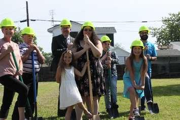 Cassadi Pryor and her four neices and nephews, Kailyn, Isaiah, Brooklyn and Gavin break ground on their new home with Mayor Darrin Canniff and members from the Habitat for Humanity organization. Photo by Michael Hugall) 