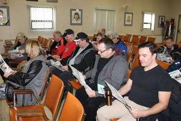Employees in Drive-Away and TCT of Auto Warehousing Company in Windsor review contract details during a vote meeting at the local's hall in Windsor, Jan 15, 2017 (Photo courtesy of Unifor Local 444/Facebook)