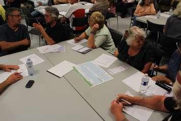 Local residents discuss shoreline erosion in Erieau during public information meeting at the Erieau fire hall, June 19, 2019. (Photo by Allanah Wills)