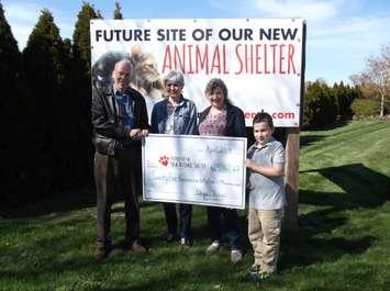 Friends of the new Animal Shelter committee member Dr. Bruce Warwick accepts a cheque from L’Ecuyer family members Cherie Metcalfe, Audrey L'Ecuyer and grandson Christos.  (Photo courtesy of Municipality of Chatham-Kent)