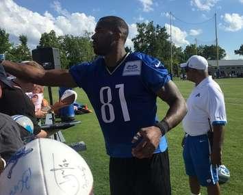 Lions receiver Calvin Johnson signs autographs during 2015 Training Camp. (Photo by Scott Despins)