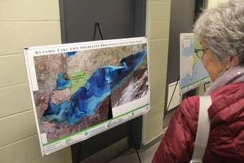 Resident looks at image of the Lake Erie shoreline from space at the Shoreline Study Meeting in Erieau on April 10, 2019. (Photo by Allanah Wills)