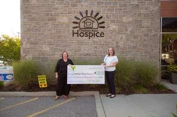 Pictured presenting a cheque on behalf of 100 Women Who Care Chatham-Kent to Jodi Maroney (right), Executive Director of the Chatham-Kent Hospice Foundation, is nominating 100 Women Who Care Member, Barb McEwan (left).  (Photo by Aimee Lynn Photography)