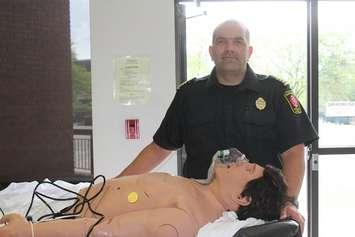 Assistant EMS Chief Scott Ramey with CPR demonstration doll at Chatham Civic Centre. May 29, 2017. (Photo courtesy of Sarah Cowan Blackburn News Chatham-Kent) 