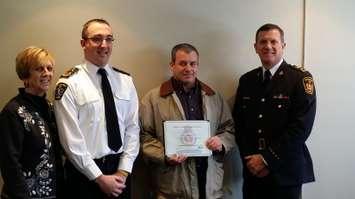 Chatham-Kent paramedic Paul Tremblay receives recognition at the Chatham-Kent Police Board meeting on February 17 2015 (Photo by Jake Kislinsky).
