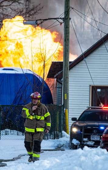 A firefighter at the scene of a fire on Alfred Street in Chatham. February 16, 2021. (Photo credit: Jesse Verleye)