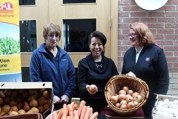 Kent Federation of Agriculture representative Mary Anne Udvari marks Food Freedom Day with Brenda LeClair (left) and Salvation Army Captain Stephanie Watkinson. February 9, 2016 (Photo by Simon Crouch) 