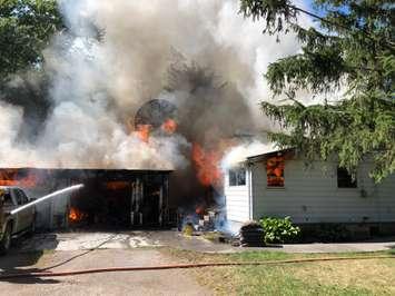 The scene of a house fire on Charing Cross Rd. in Raleigh Township. July 8, 2018. (Photo courtesy of Chatham-Kent Fire and Emergency Services)