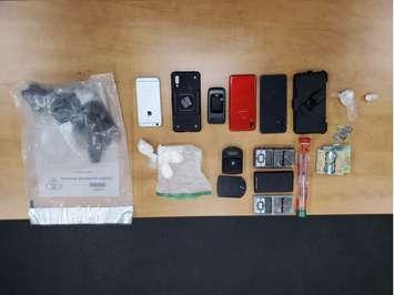 Items seized during a police search of a home on Talbot Trail east of Wheatley on March 12, 2022. (Photo courtsey of Essex OPP)