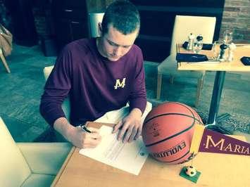 Marley Blommers signs letter of intent to attend Marianapolis Prep school in Connecticut.  May 6 2015 (Photo by Simon Crouch) 