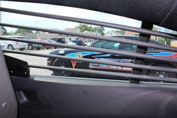 Back of a Chatham-Kent police cruiser looking out the right window. (Photo by Greg Higgins)