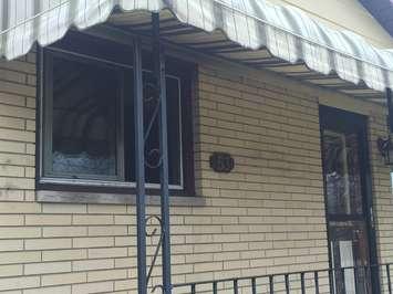 Only some dark spots around a front window reveal a fire took place inside this Houston St. home. (Photo by Mike James)