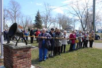 Ringing the bell to celebrate Erieau's 100th anniversary. April 5, 2017. (Photo by Natalia Vega)