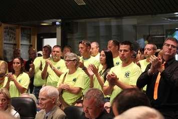 Paramedics applaud during a Chatham-Kent Council meeting. Council was debating a blended Fire/EMS service for the municipality, June 27, 2016 (Photo by Jake Kislinsky)