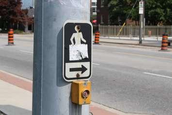 The crossing walk button at Wyandotte St. E. and Devonshire Rd. in Windsor.  (Photo by Adelle Loiselle.)