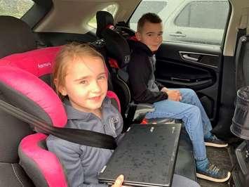 Christ The King Catholic School, Wallaceburg students Brooklyn Pilecki, Grade 1 and her brother Lucas, Grade 3, with their Chromebook, during St. Clair Catholic’s third round of technology deployment at schools across the district -Apr 29/20