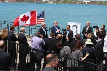 Prime Minister Stephen Harper, Michigan Gov. Rick Snyder and members of the Howe family unveil the name of Windsor-Detroit's new bridge, May 14, 2015. (Photo by Mike Vlasveld)