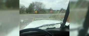 Stephen Haines said the windshield of the hydrovac truck he was driving was smashed by a banana that was thrown by someone on a school bus on Bear Line Road Tuesday afternoon. April 16, 2019. (Submitted photo)
