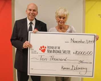 Dr. Bruce Warwick with the Friends of the New Animal Shelter accepts a cheque from Karen DeKoning. November 3,
 2017. (Submitted photo)