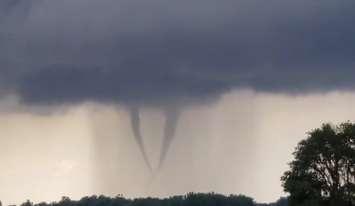 A pair of twin funnel clouds spotted near Dresden. June 30, 2021. (Photo captured from video by @tempesthunterph on Twitter)
