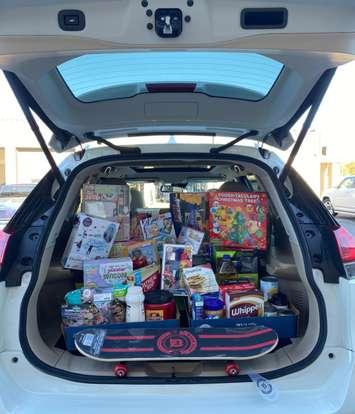 Toy and food drop-off event. Photo courtesy of Chatham Goodfellows / via Facebook).