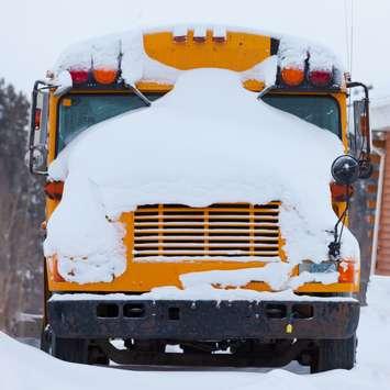 Snowy School Bus. (Photo by © Can Stock Photo / PiLens). 
