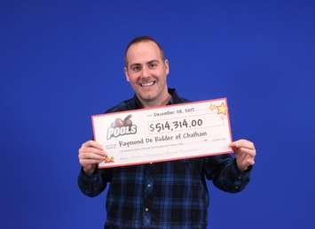 Raymond De Ridder shows off his prize from a recent win on a POOLS card he bought in Chatham. (Photo courtesy of OLG)