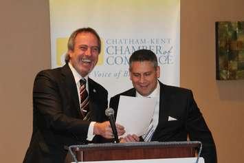 Chatham-Kent Mayor Randy Hope shares a laugh with C-K Chamber of Commerce Chair Christopher June as he takes his oath of office  Febrary 25, 2016. (Photo by Simon Crouch) 