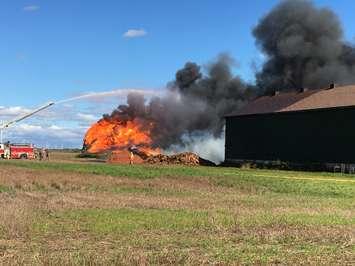 CK firefighters tackle an out of control blaze outside Blenheim on Oct 9, 2016.  The fire began in a tobacco barn and spread to another. (Photo by Debra Vlasschaert/Blackburn Radio)
