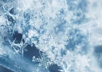 Snow flakes. (Photo by © Can Stock Photo / Anterovium). 