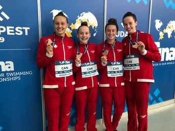 Chatham's Genevieve Sasseville (third from left)  helped Canada win bronze in the 4x200 metre freestyle relay at the FINA World Junior Swimming Championships in Budapest.  (Photo submitted by Alain Sasseville)