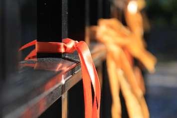 Ribbons tied to a fence at the Ska:na Family Learning Centre in Chatham. (Photo by Millar Hill)
