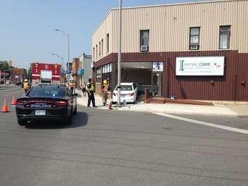 Chatham-Kent police officers were investigating after a car crashed into a Dover St. Building Sept. 1, 2015 (Photo by Simon Crouch) 