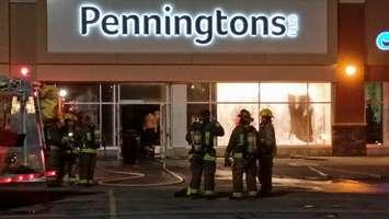 Crews clean up following a fire at the Pennington's on Grand Ave. W (Photo taken by Jake Kislinsky)