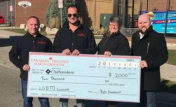Cheque presentation towards the rainbow crosswalk in Chatham. December 1, 2017. (Photo courtesy of the Municipality of Chatham-Kent).