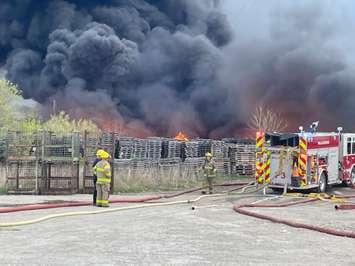Chatham-Kent firefighters respond to a large pallet fire Wednesday at 760 Gillard Street in Wallaceburg. (Photo via CK Fire) 