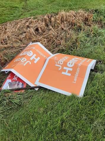 Damaged NDP and Liberal campaign signs at the corner of Egremont Drive and Nairn Road in Middelsex Centre.  September 2021. (Photo courtesy of David McLean).
