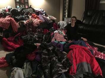 Klare Rumble with the winter coats she collected for Operation Cover Up. (Photo courtesy of the CK Salvation Army)