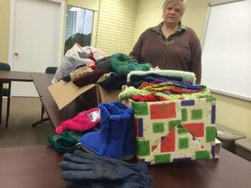 Chatham-Kent Salvation Army Family Services Coordinator Rhonda Dickson stands by donated mittens, scarves and toques at their offices at 19 Raleigh St. in Chatham on February 12, 2015. (Photo by Ricardo Veneza)
