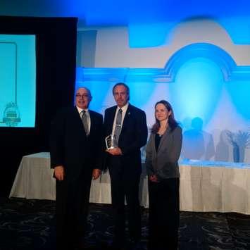 Chatham-Kent Mayor Randy Hope is presented with the 20/20 Leadership Award by John Wabb, Vice-President of the Canadian Union of Skilled Workers (left) and Nicole Risse, Interim Executive Director of OSEA (right). (Photo courtesy Municipality of Chatham-Kent)