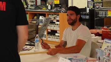 Calgary Flames Defenceman and Chatham-Kent Native TJ Brodie signs autographs at the Canadian Tire in Chatham (Photo by Jake Kislinsky)