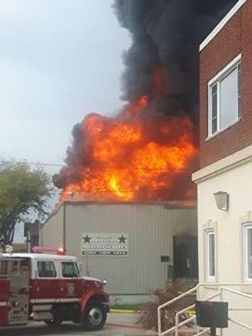 Church's Army Surplus store in flames on October 14, 2017. Photo courtesy of Andrew Callow/Facebook. Used with permission.