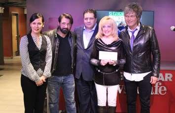 (left to right) Jhoan Baluyot-Lucier of Caesars Windsor, Jody Raffoul of The S'Aints, Ron Seguin with St. Clair College, June Muir with the Windsor-Essex Unemployed Help Centre and Jeff Burrows of The S'Aints, January 28, 2015. (Photo by Mike Vlasveld)