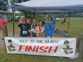 Runners at the finish line of the 19th Annual Trot to the Beach fundraiser on Saturday, June 11, 2022. (Photo courtesy of JP Huggins)