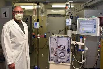 Dr. Chris McIntyre with the modified dialysis device he is using to reprogram white blood cells in critical COVID-19 patients in London. Photo courtesy of Lawson Health Research Institute. 