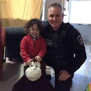 Two-year-old Elijah Moulden (left) and Chatham-Kent Police Const. John Hicks. (Photo courtesy Chatham-Kent Police Service)