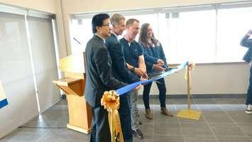 From left, UW vice-president of research and innovation Michael Siu, UW president Alan Wildeman, UW biology professor Dr. Trevor Pitcher and UW student Marlena McCabe cut the ribbon opening the Freshwater Restoration Ecology Centre in LaSalle on May 24, 2017 (Photo by Mark Brown/Blackburn News)