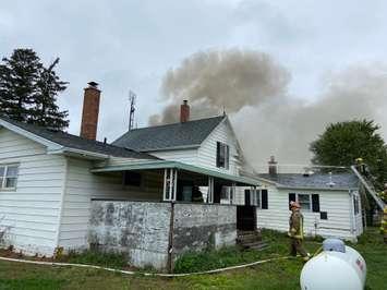 Fire crews are on scene of residential structure fire at 29657 Zone Rd 4.  (Photo courtesy of Chatham-Kent Fire via Twitter)